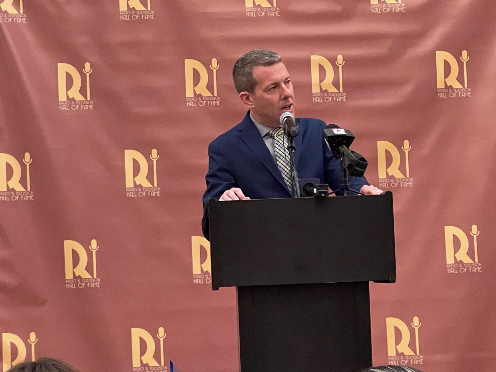 Tim White speaking at the RI Radio & Television Hall of Fame